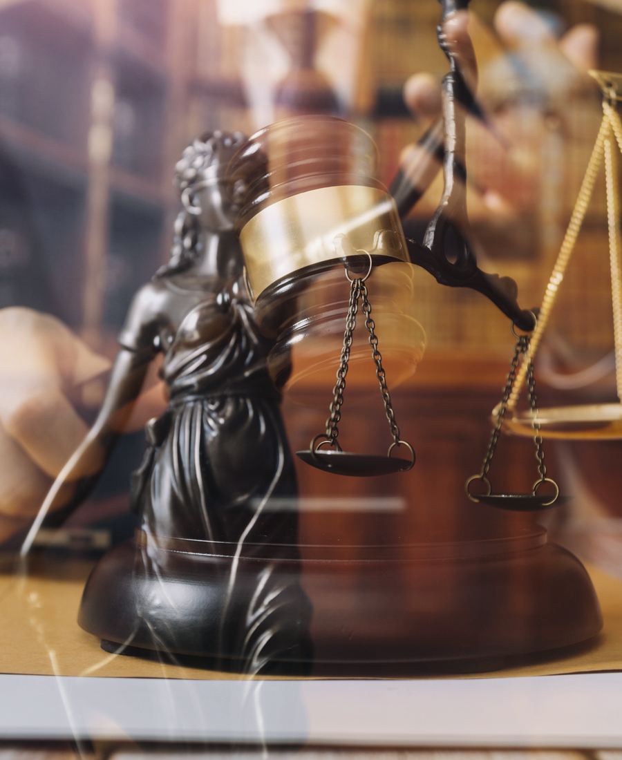 Lady Justice statue and scales on a judge’s bench